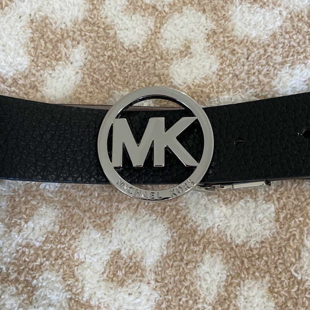 Michael Kors Belt: new condition, black and silver color, size M.